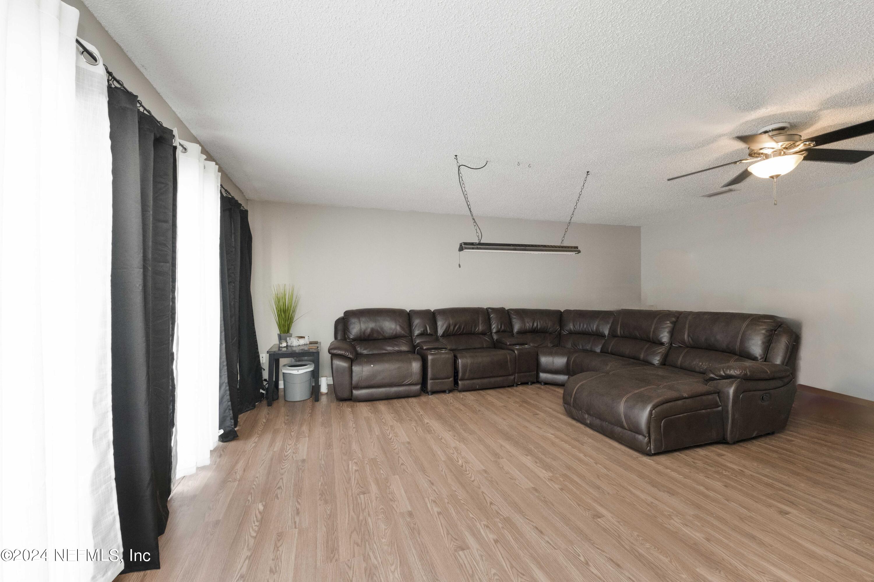 2532 Wattle Tree Road West Jacksonville, FL 32246 - Photo 13 of 25 a living room with furniture and a wooden floor
