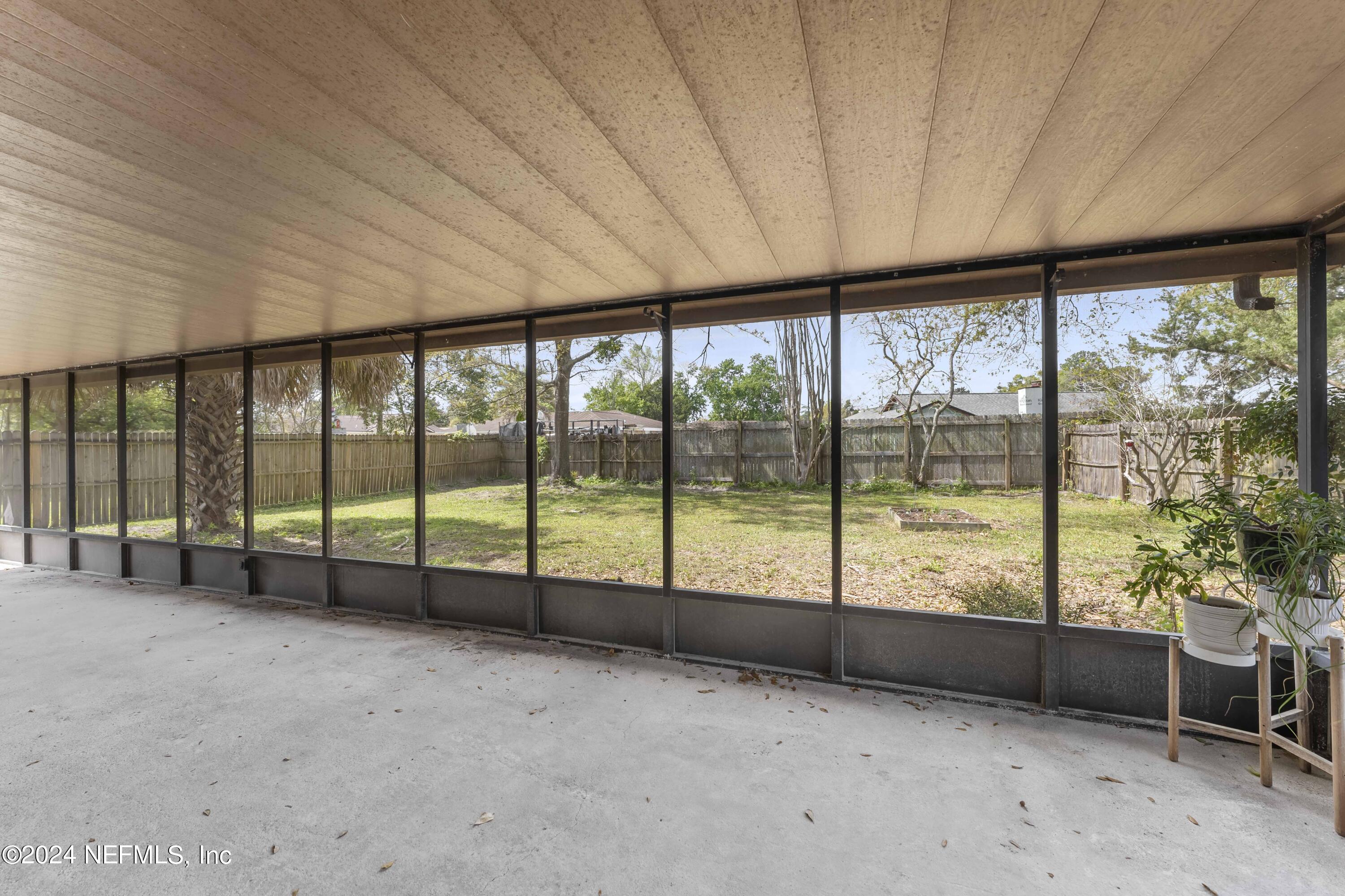 2532 Wattle Tree Road West Jacksonville, FL 32246 - Photo 20 of 25 a view of an empty room with a large window