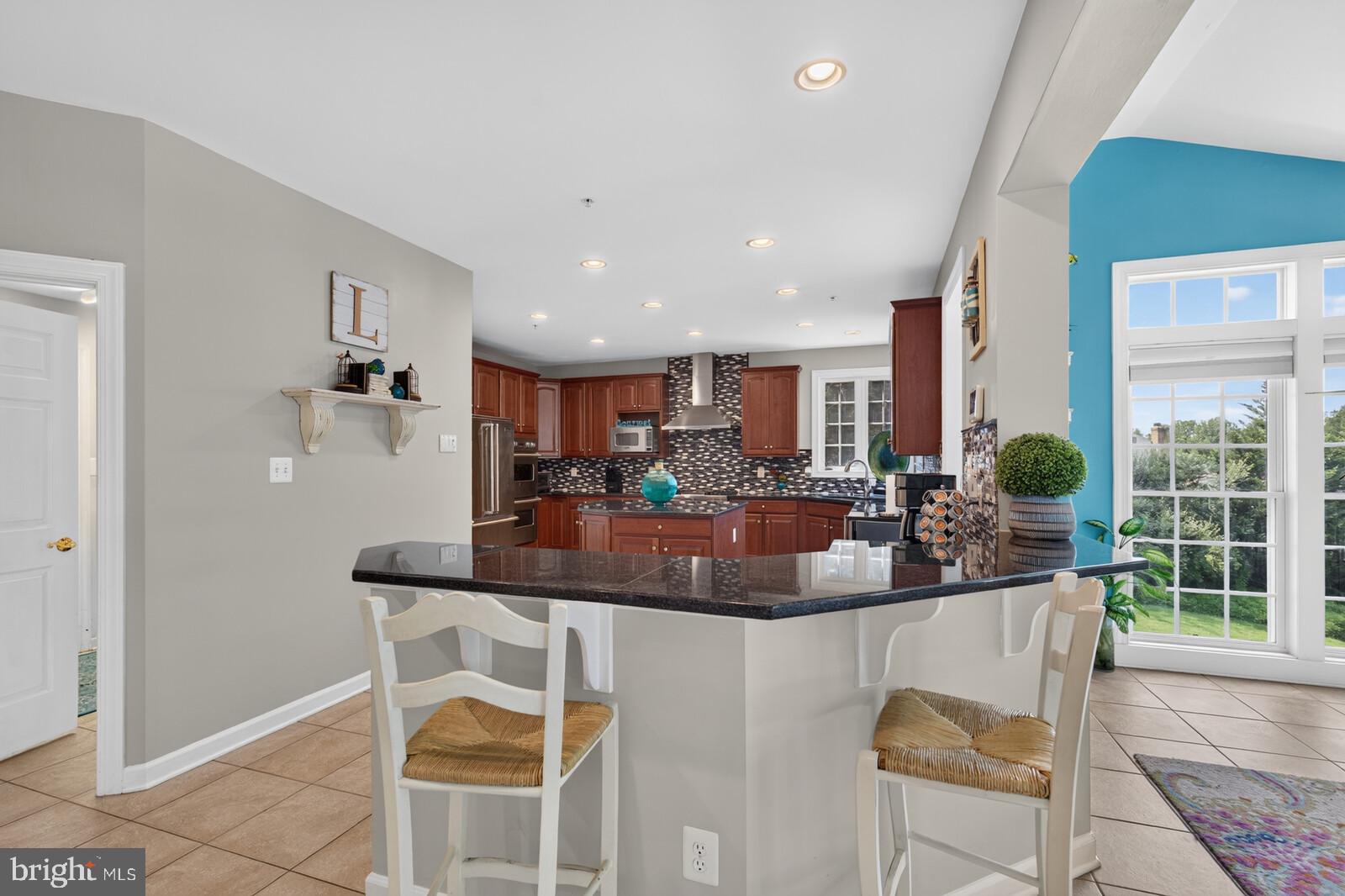 9451 Brink Road Gaithersburg, MD 20882 - Photo 15 of 57 Bar seating in kitchen