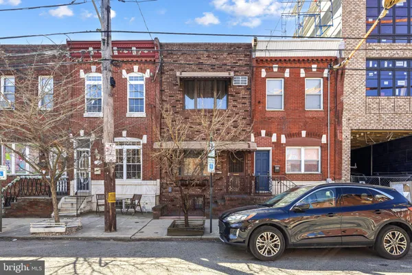 a car parked in front of a building