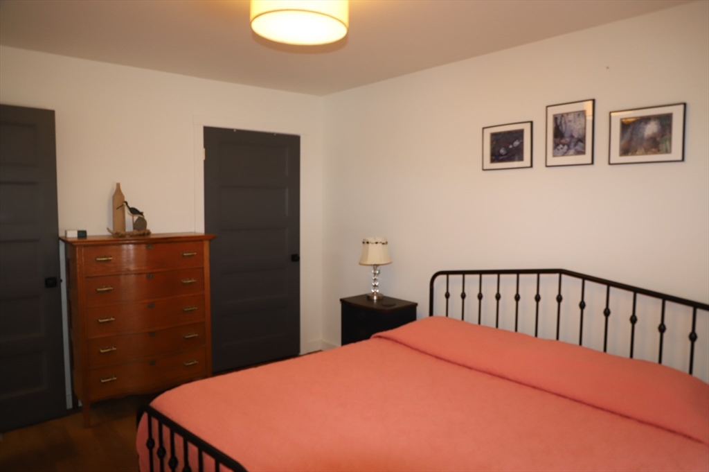 6 Path Road Tolland, MA 01034 - Photo 12 of 36 a bed sitting in a bedroom next to a bathroom