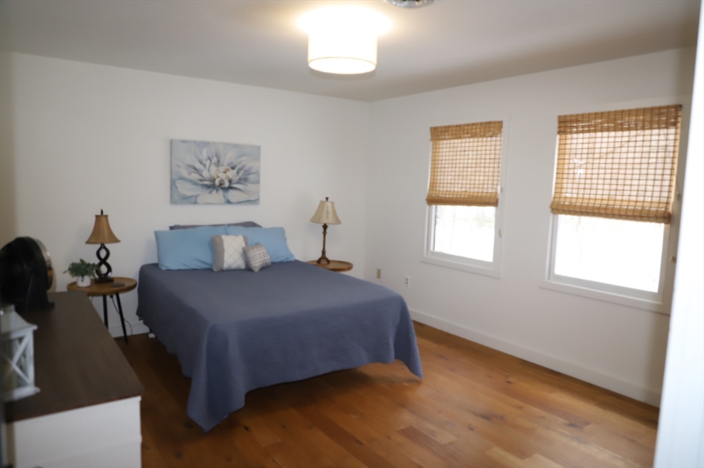 6 Path Road Tolland, MA 01034 - Photo 21 of 36 a bedroom with a bed and wooden floor
