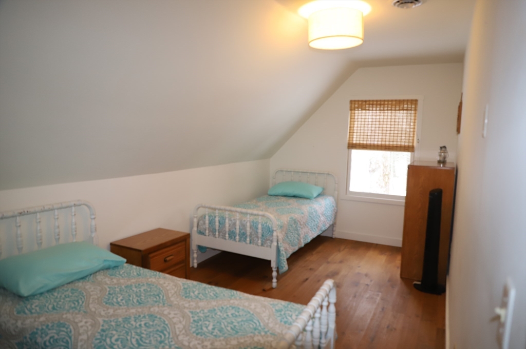 6 Path Road Tolland, MA 01034 - Photo 23 of 36 a bedroom with a bed and a window