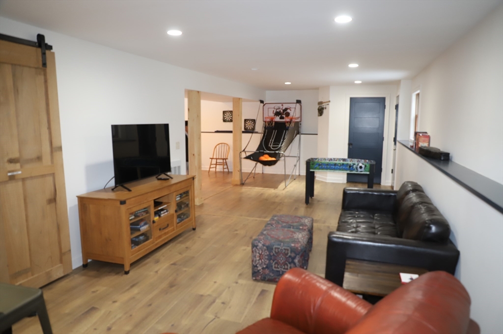 6 Path Road Tolland, MA 01034 - Photo 30 of 36 a living room with furniture and a flat screen tv