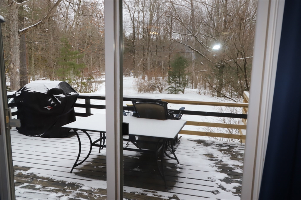 6 Path Road Tolland, MA 01034 - Photo 34 of 36 a balcony with chairs and a table