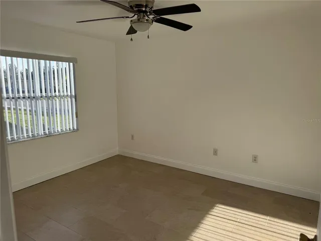a view of a hallway view with wooden floor and staircase