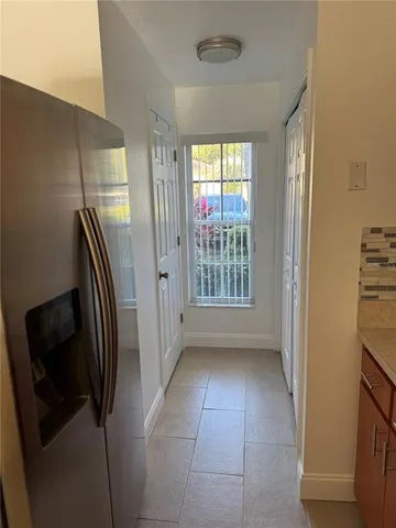 a bathroom with a granite countertop shower a sink and a mirror