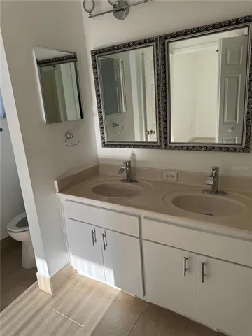 an empty room with a window and a wooden floor