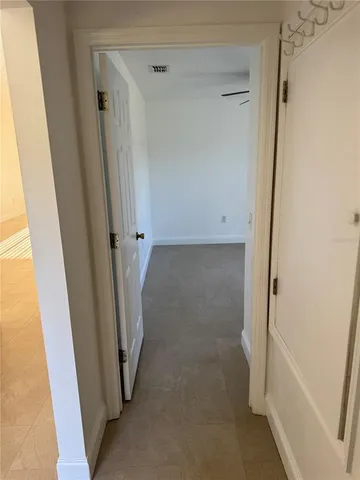 an empty room with wooden floor