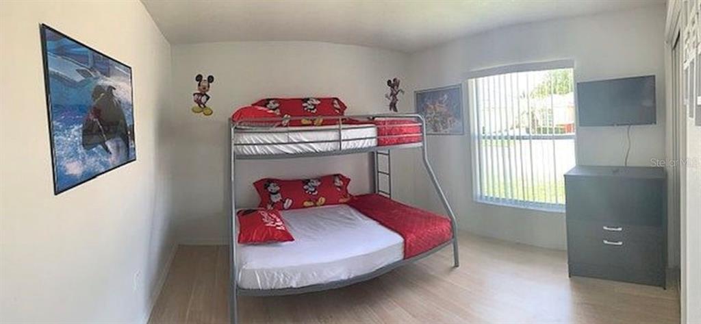 2208 Mystic Ring Loop Kissimmee, FL 34759 - Photo 9 of 12 a living room with furniture and a window