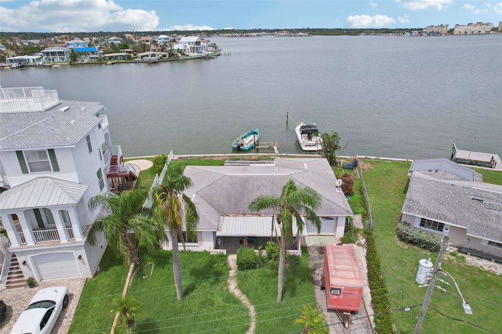 16033 Redington Drive Redington Beach, FL 33708 - Photo 16 of 26 a aerial view of a house with outdoor space and lake view