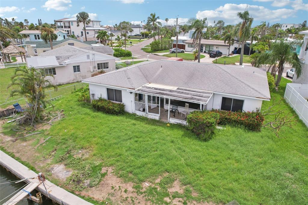 16033 Redington Drive Redington Beach, FL 33708 - Photo 18 of 26 a view of a house with a big yard plants and large trees