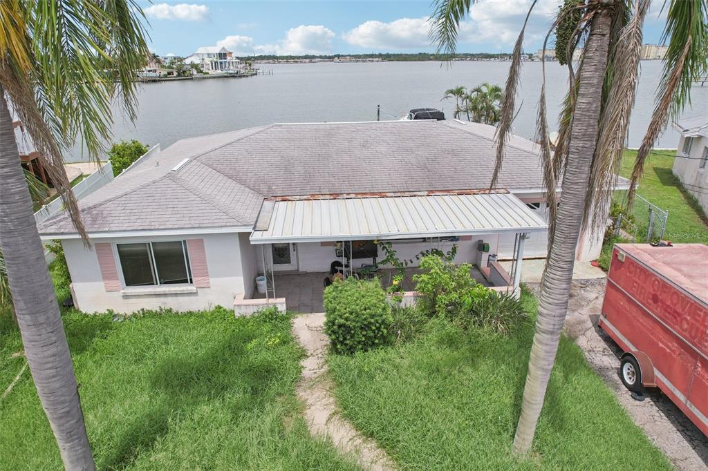 16033 Redington Drive Redington Beach, FL 33708 - Photo 5 of 26 a aerial view of a house with a yard and potted plants