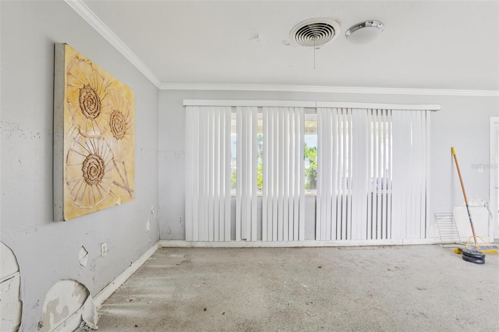16033 Redington Drive Redington Beach, FL 33708 - Photo 7 of 26 a view of an empty room with a window