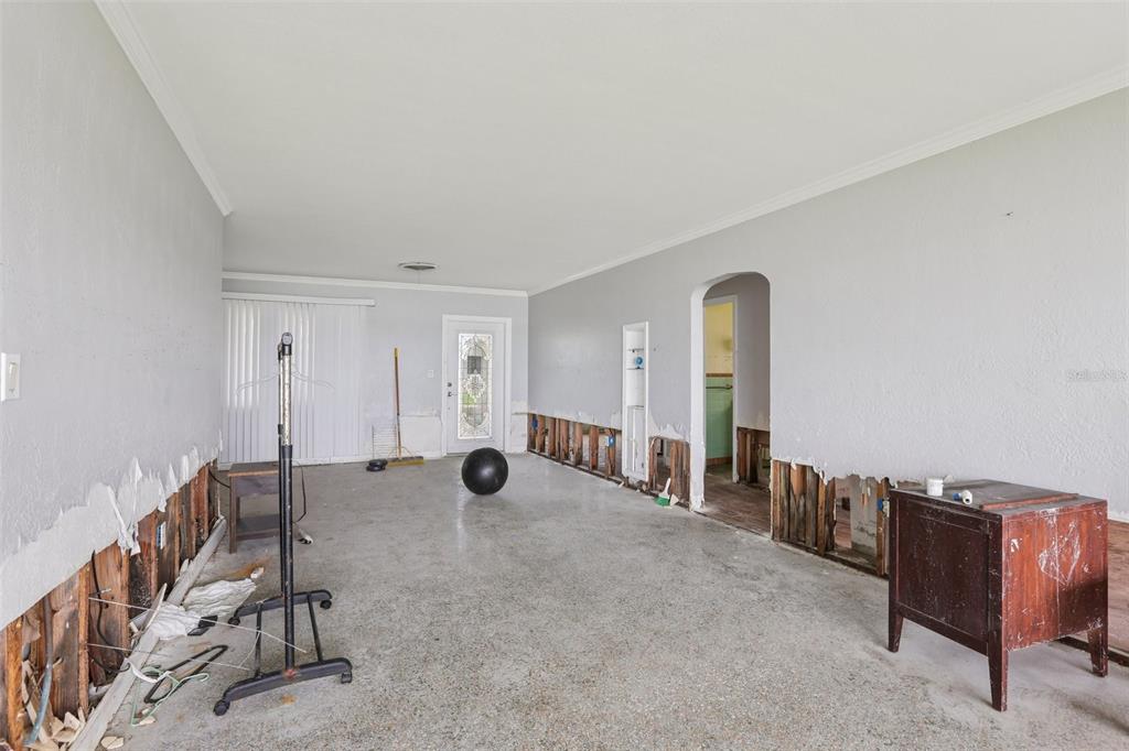 16033 Redington Drive Redington Beach, FL 33708 - Photo 8 of 26 a view of an empty room with glass windows