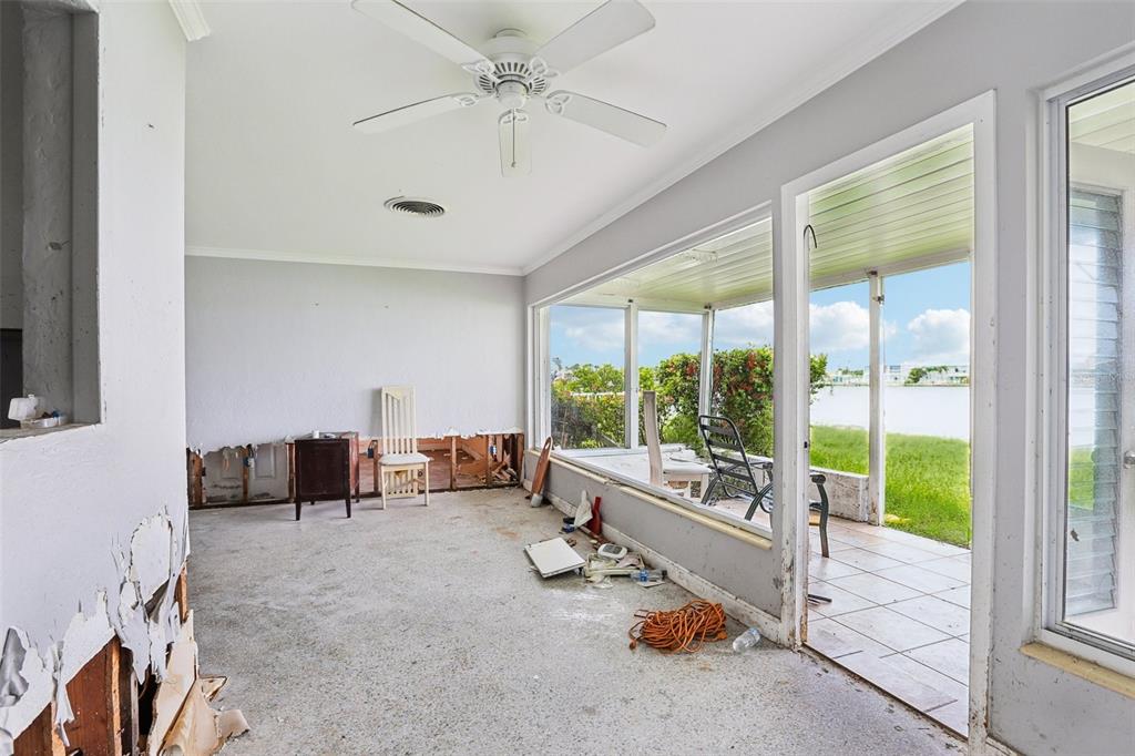 16033 Redington Drive Redington Beach, FL 33708 - Photo 9 of 26 a living room with furniture and a large window