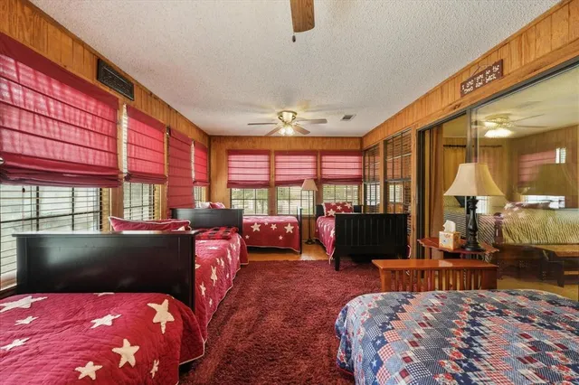 a bathroom with double vanity sink a mirror and a shower