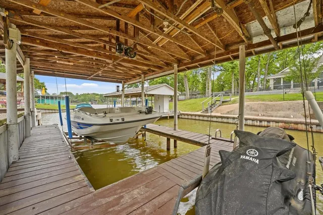 a view of a swimming pool with an outdoor seating and a yard
