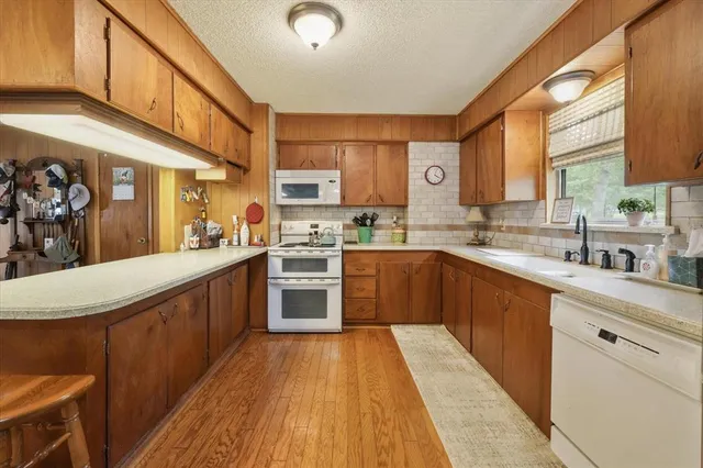 a dining hall view with a large dining table and chairs