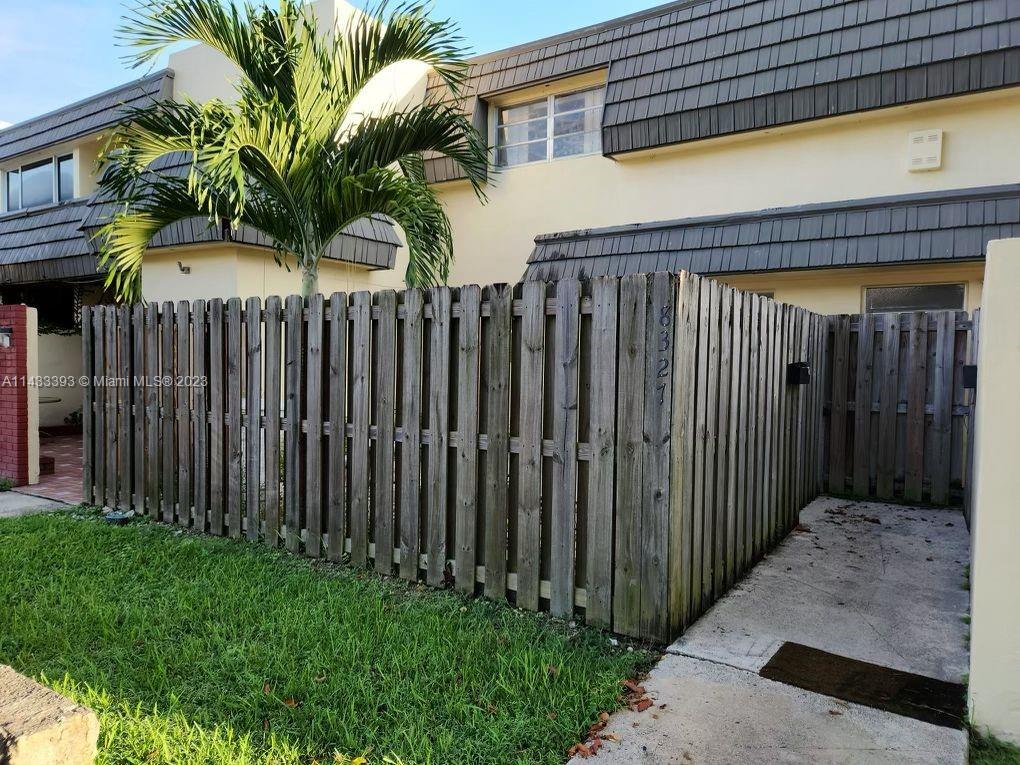 a view of a backyard with potted plants