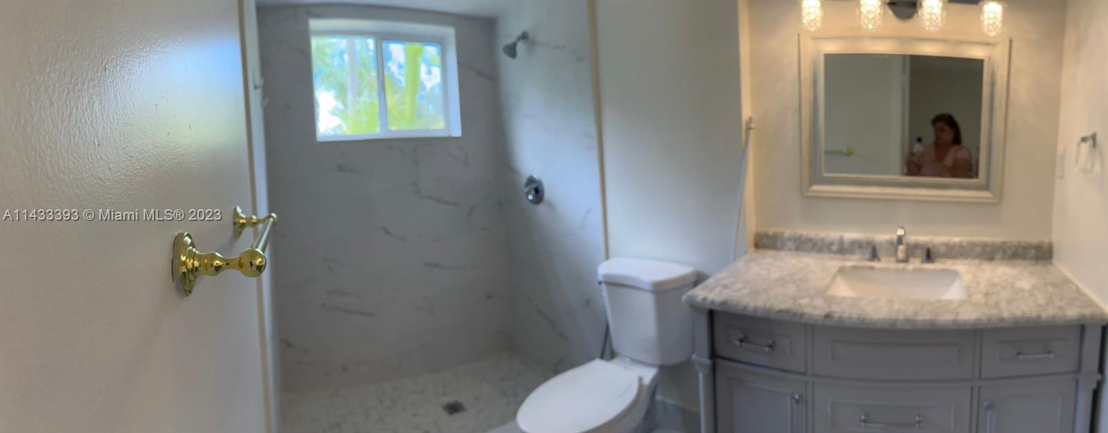 8327 Southwest 137th Avenue, Unit 8327 Miami, FL 33183 - Photo 11 of 31 a bathroom with a toilet and a sink