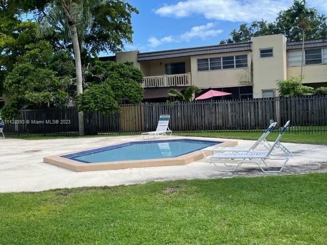 8327 Southwest 137th Avenue, Unit 8327 Miami, FL 33183 - Photo 30 of 31 a view of a backyard with a small cabin