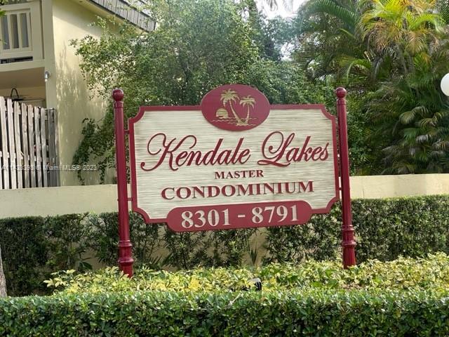 8327 Southwest 137th Avenue, Unit 8327 Miami, FL 33183 - Photo 31 of 31 a sign broad in front of red brick house