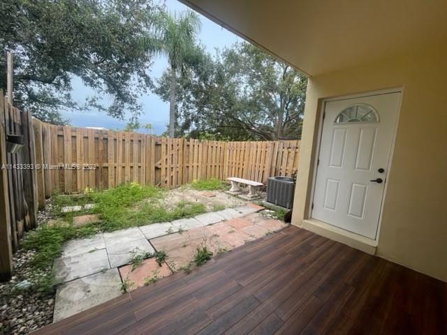 8327 Southwest 137th Avenue, Unit 8327 Miami, FL 33183 - Photo 10 of 31 a view of backyard with deck and garden