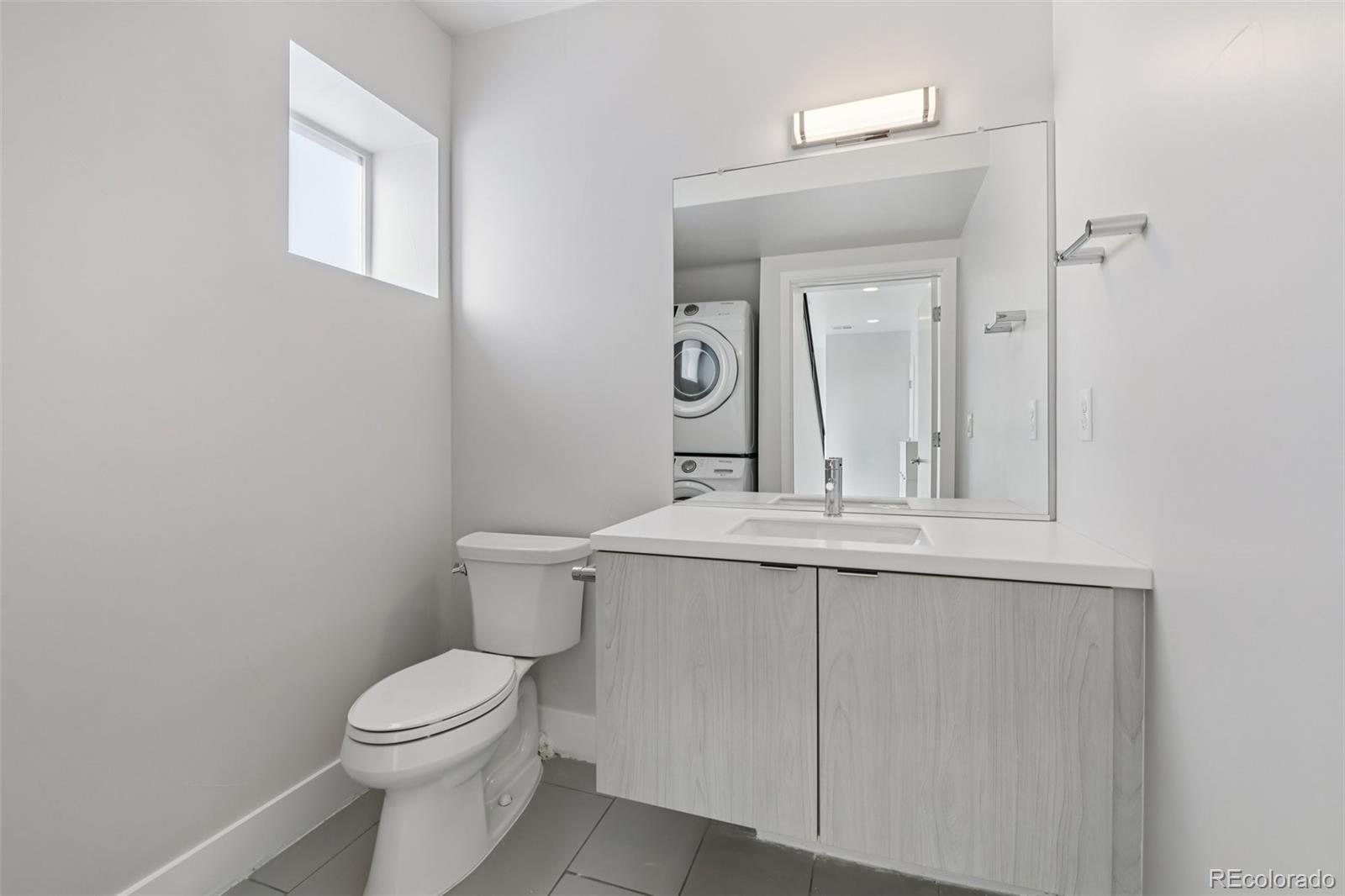 1274 Quitman Street, Unit 6 Denver, CO 80204 - Photo 14 of 50 a bathroom with a sink and a toilet