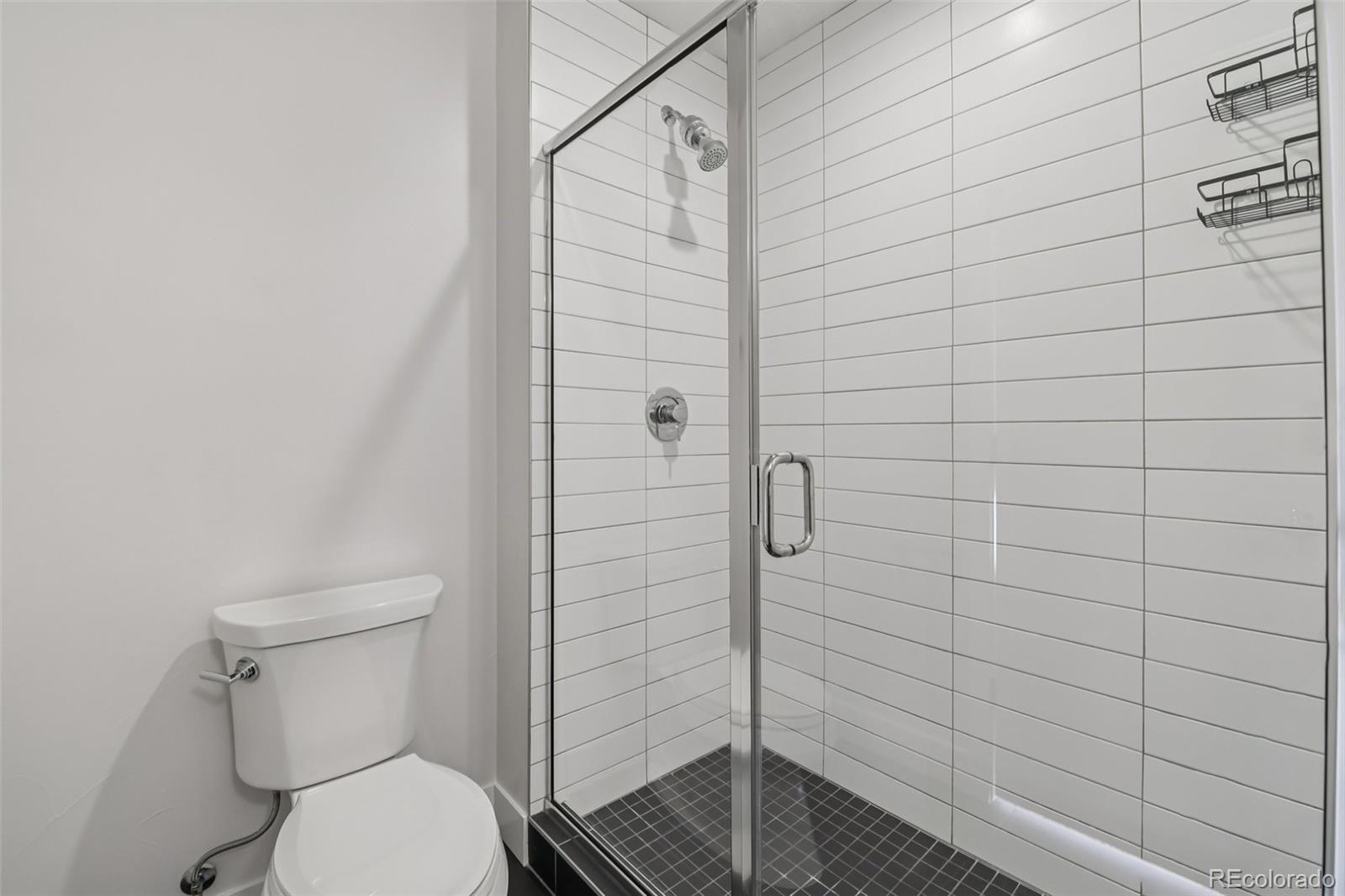1274 Quitman Street, Unit 6 Denver, CO 80204 - Photo 21 of 50 a bathroom with a shower