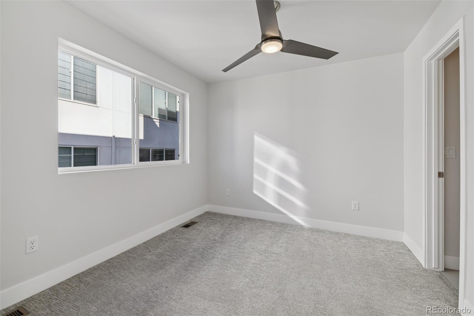 1274 Quitman Street, Unit 6 Denver, CO 80204 - Photo 22 of 50 a view of an empty room with a window
