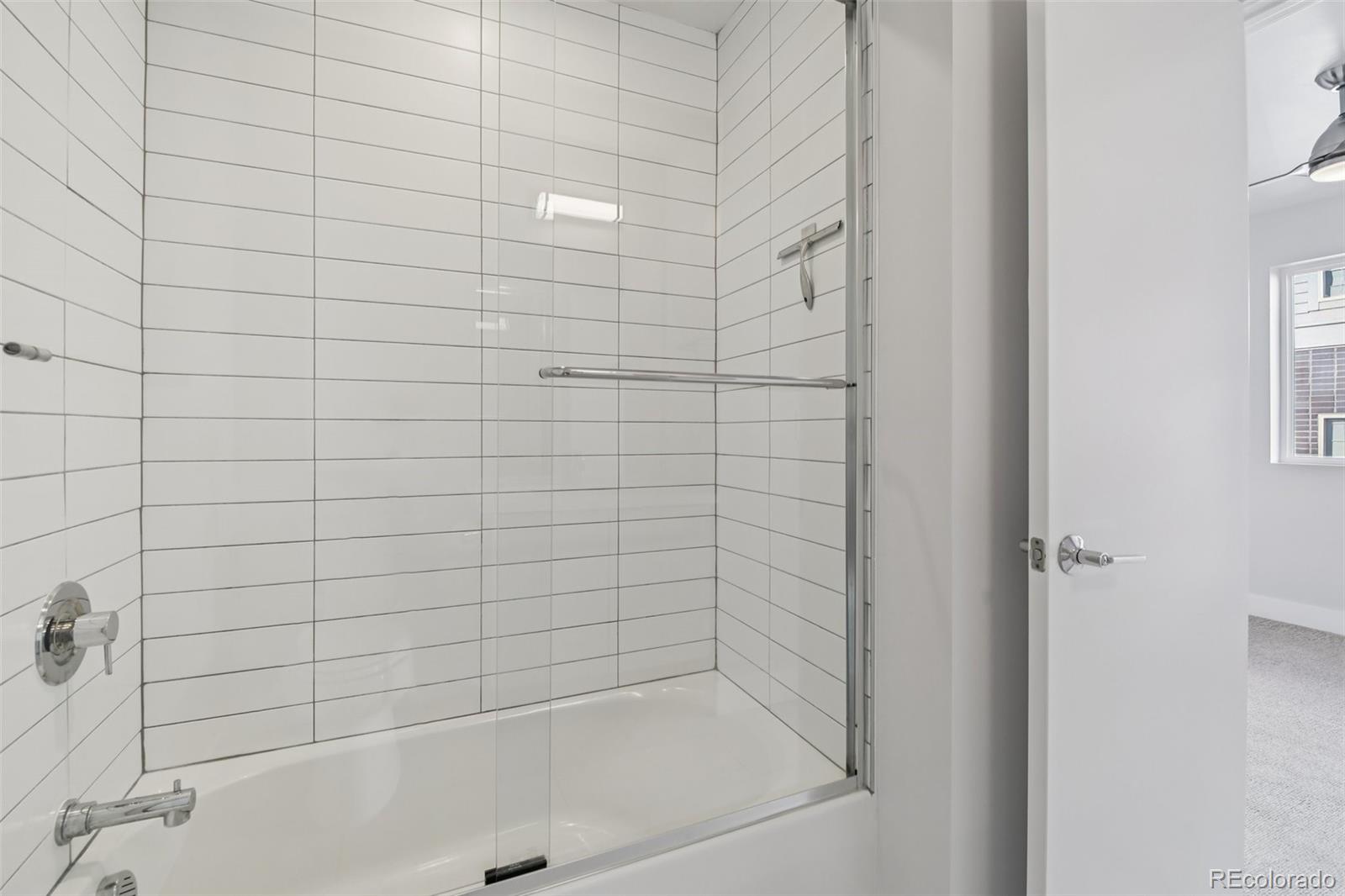 1274 Quitman Street, Unit 6 Denver, CO 80204 - Photo 25 of 50 a bathroom with a bathtub