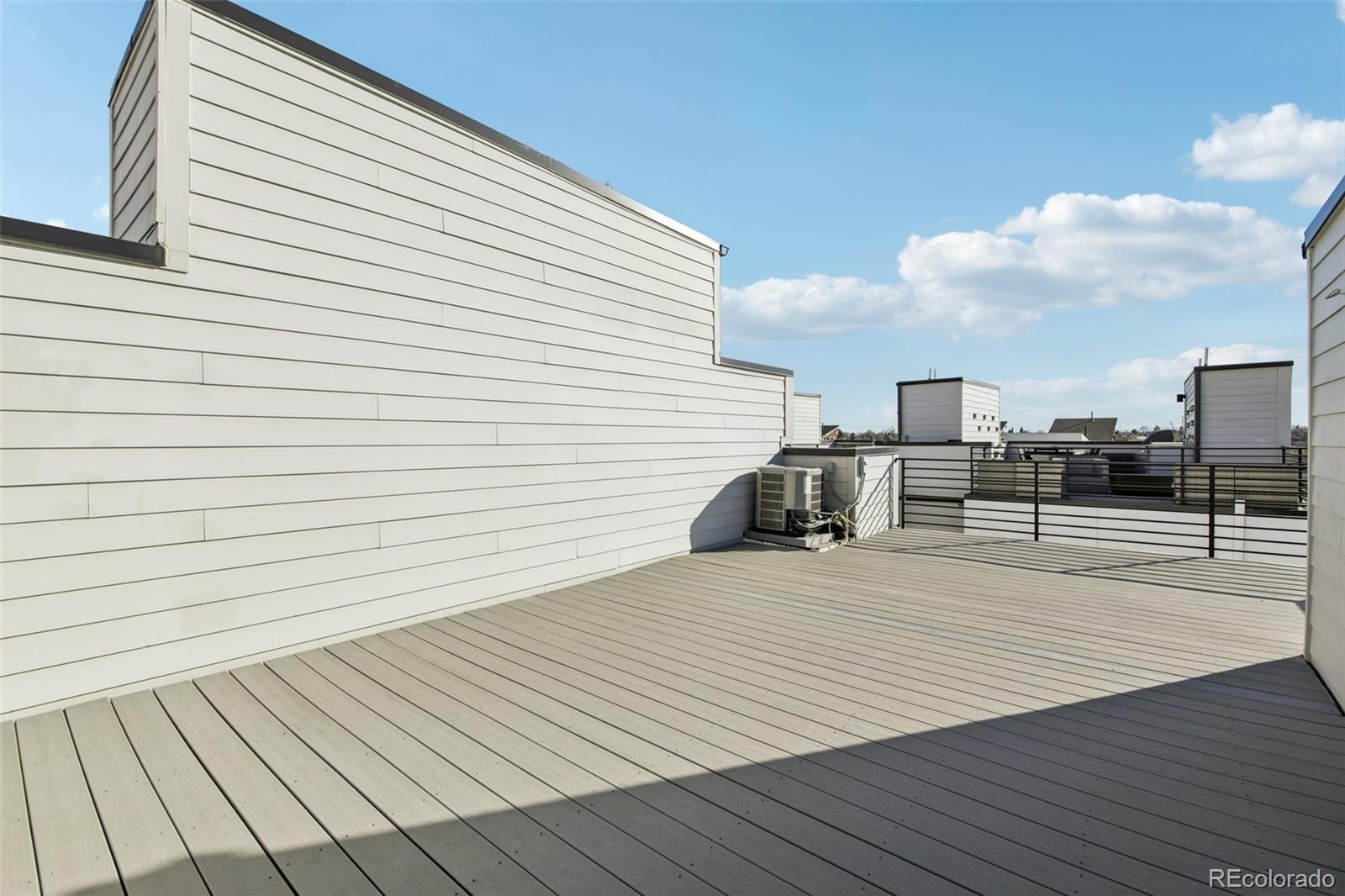 1274 Quitman Street, Unit 6 Denver, CO 80204 - Photo 27 of 50 a view of a terrace with seating space