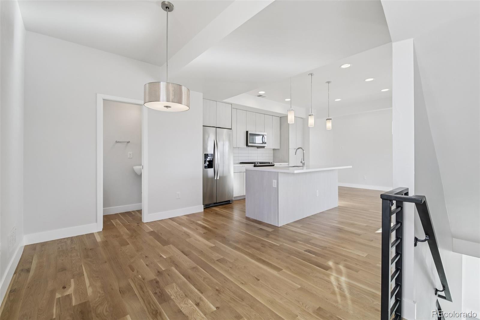 1274 Quitman Street, Unit 6 Denver, CO 80204 - Photo 5 of 50 a view of kitchen with wooden floor