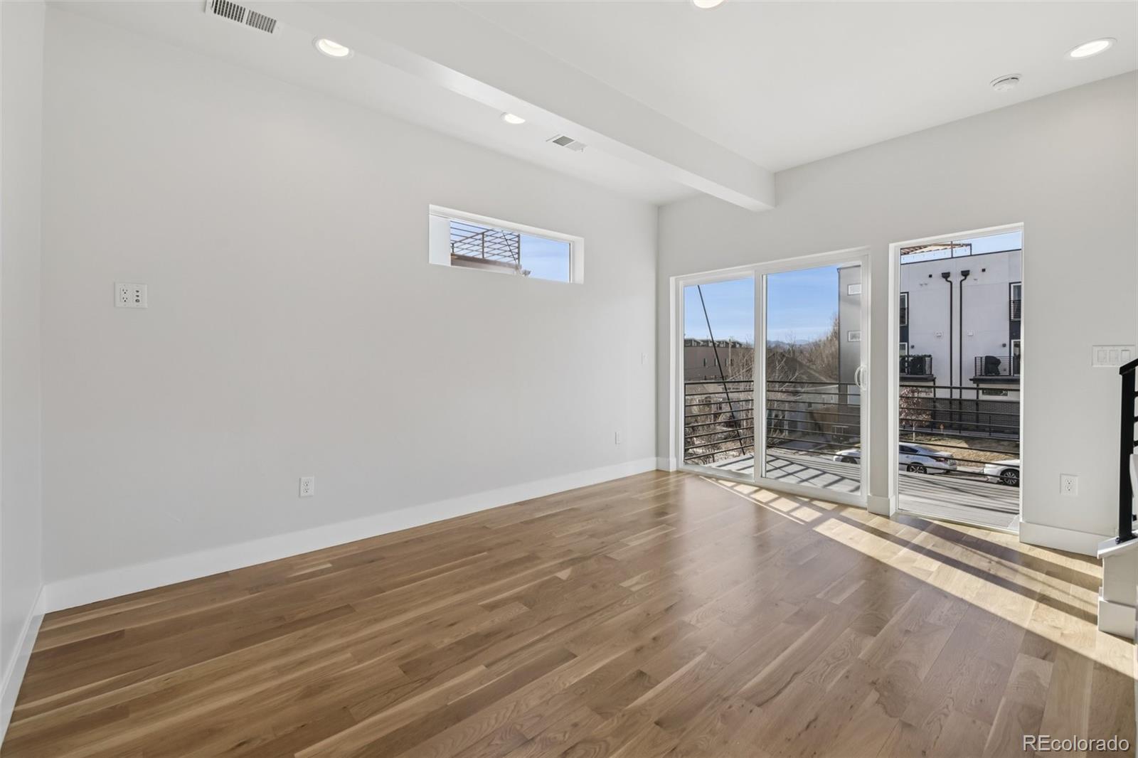 1274 Quitman Street, Unit 6 Denver, CO 80204 - Photo 6 of 50 a view of an empty room with wooden floor