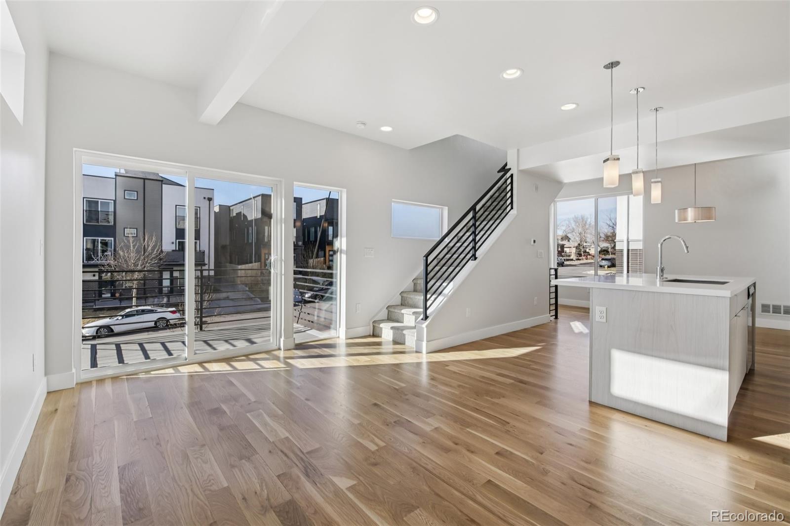 1274 Quitman Street, Unit 6 Denver, CO 80204 - Photo 8 of 50 a view of front door and hallway with wooden floor