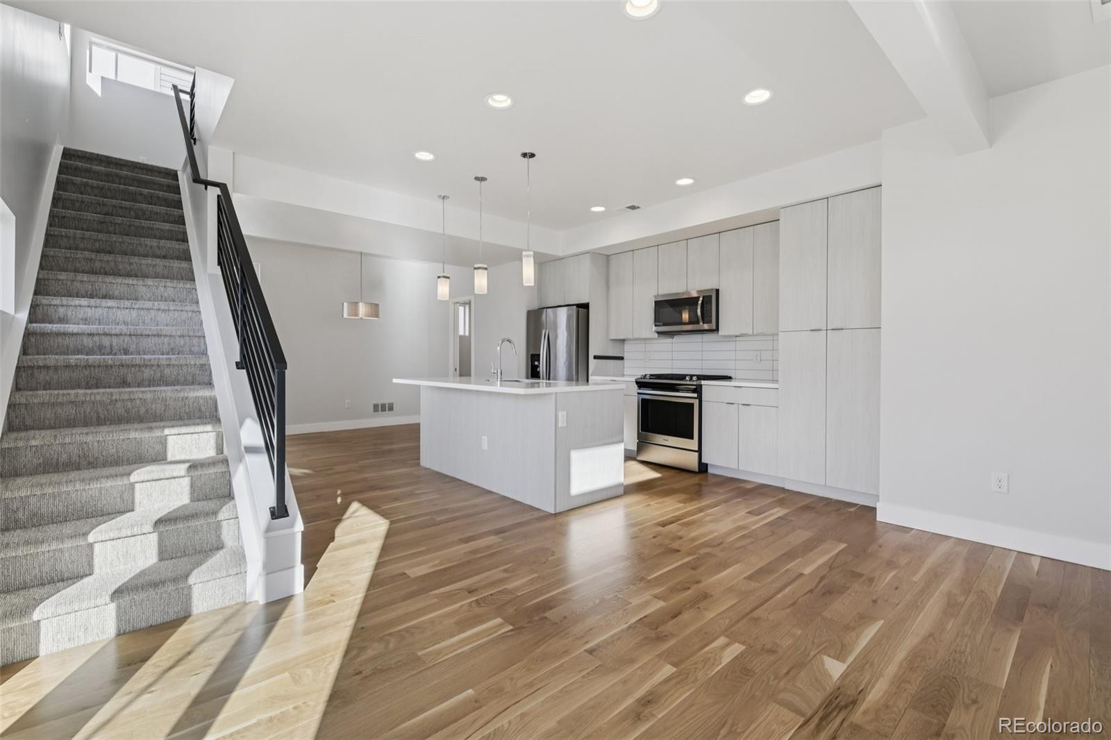 1274 Quitman Street, Unit 6 Denver, CO 80204 - Photo 9 of 50 a view of kitchen with sink and refrigerator