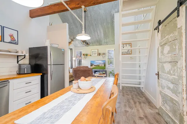 a kitchen with stainless steel appliances a white stove top oven and sink