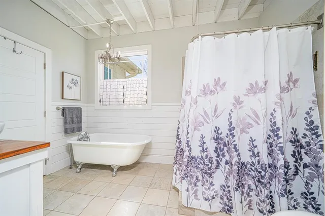 a bathroom with a toilet and shower