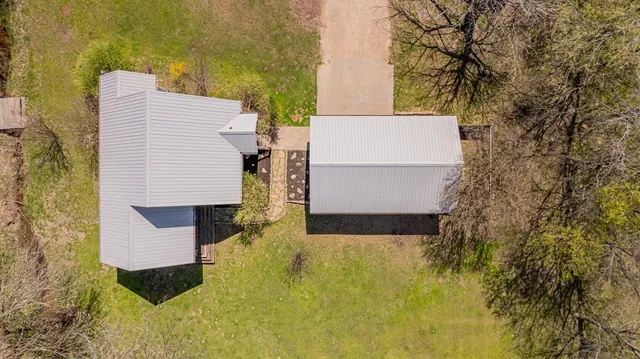 a view of building with yard and staircase