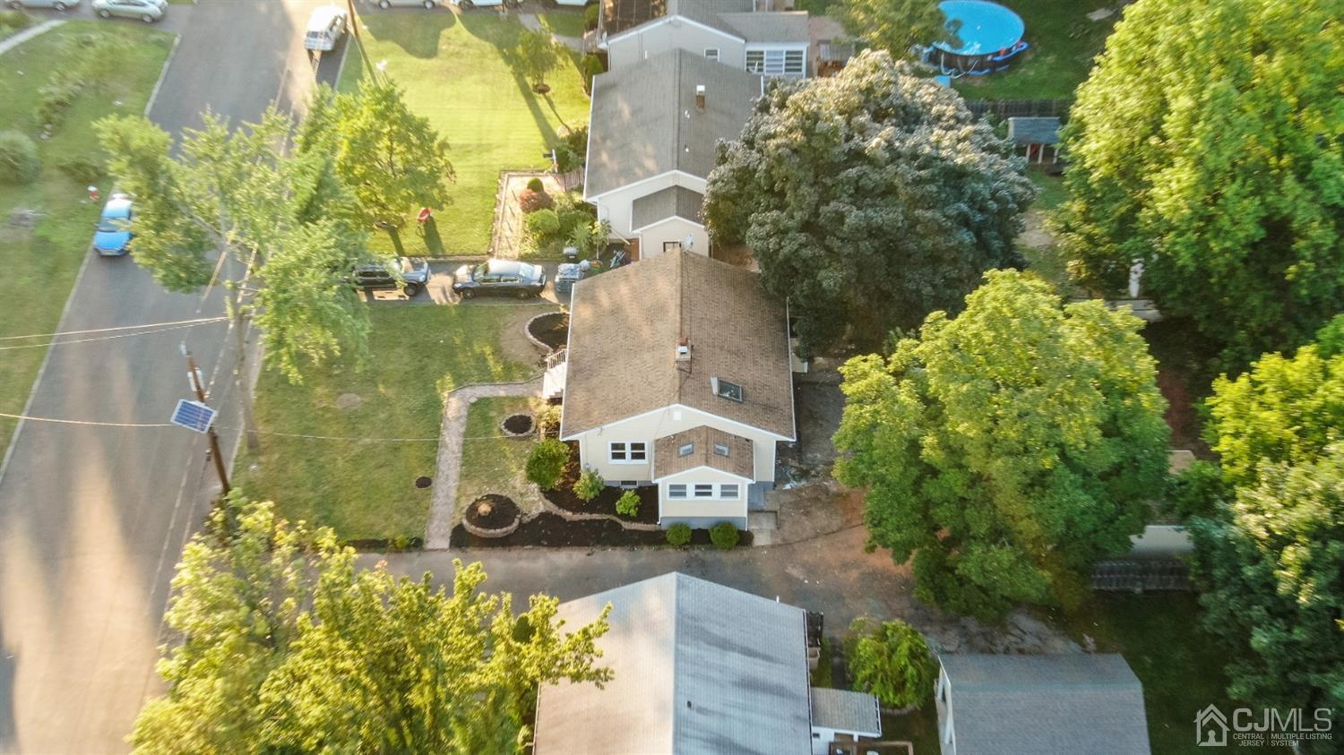 282 Lawrence Avenue North Plainfield, NJ 07063 - Photo 23 of 27 an aerial view of a house with a yard swimming pool and outdoor seating