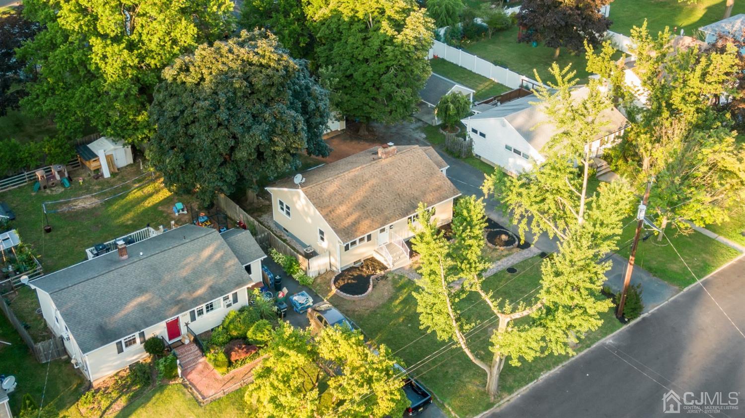 282 Lawrence Avenue North Plainfield, NJ 07063 - Photo 24 of 27 an aerial view of residential house with swimming pool and lawn chairs