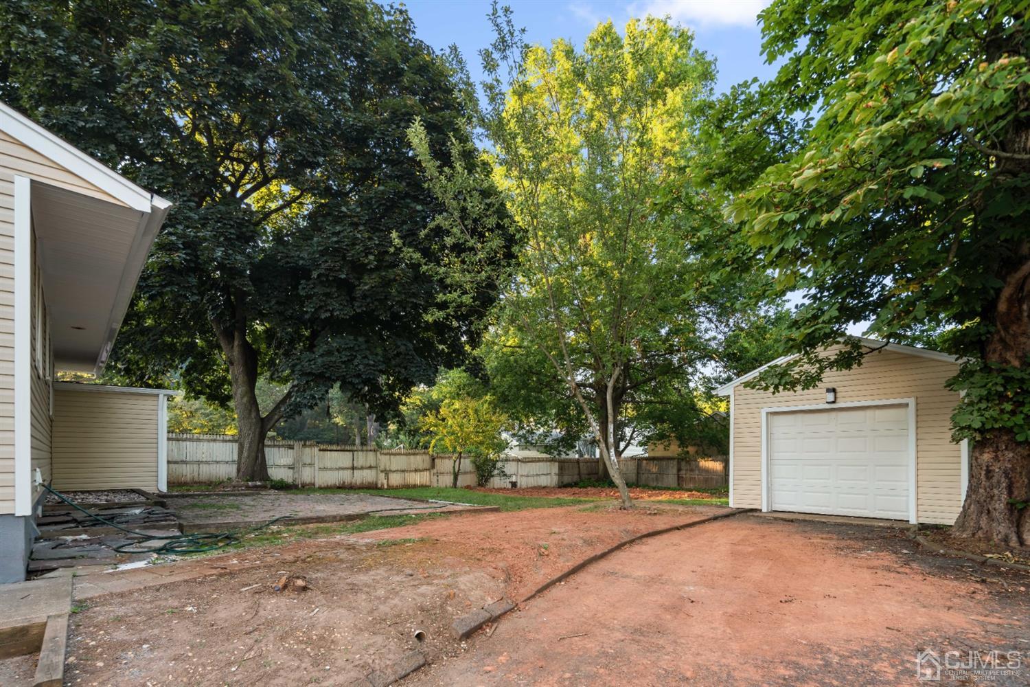 282 Lawrence Avenue North Plainfield, NJ 07063 - Photo 26 of 27 a view of a house with a tree and plants