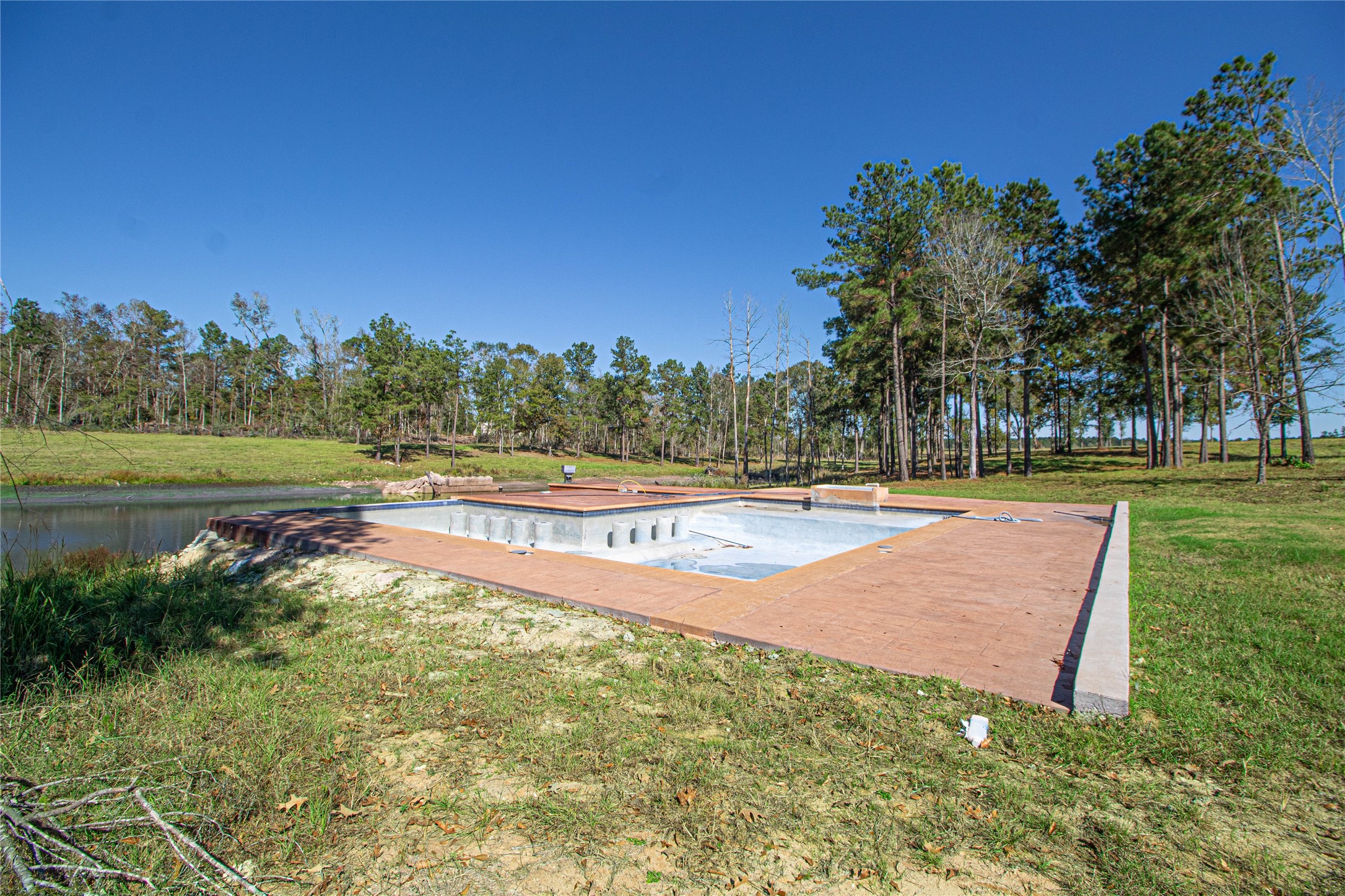 1275 Castlewood Road Livingston, TX 77351 - Photo 13 of 50 a view of a swimming pool with an outdoor space and seating area