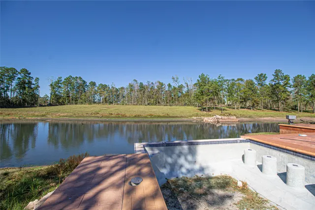 a view of a lake with houses in the back