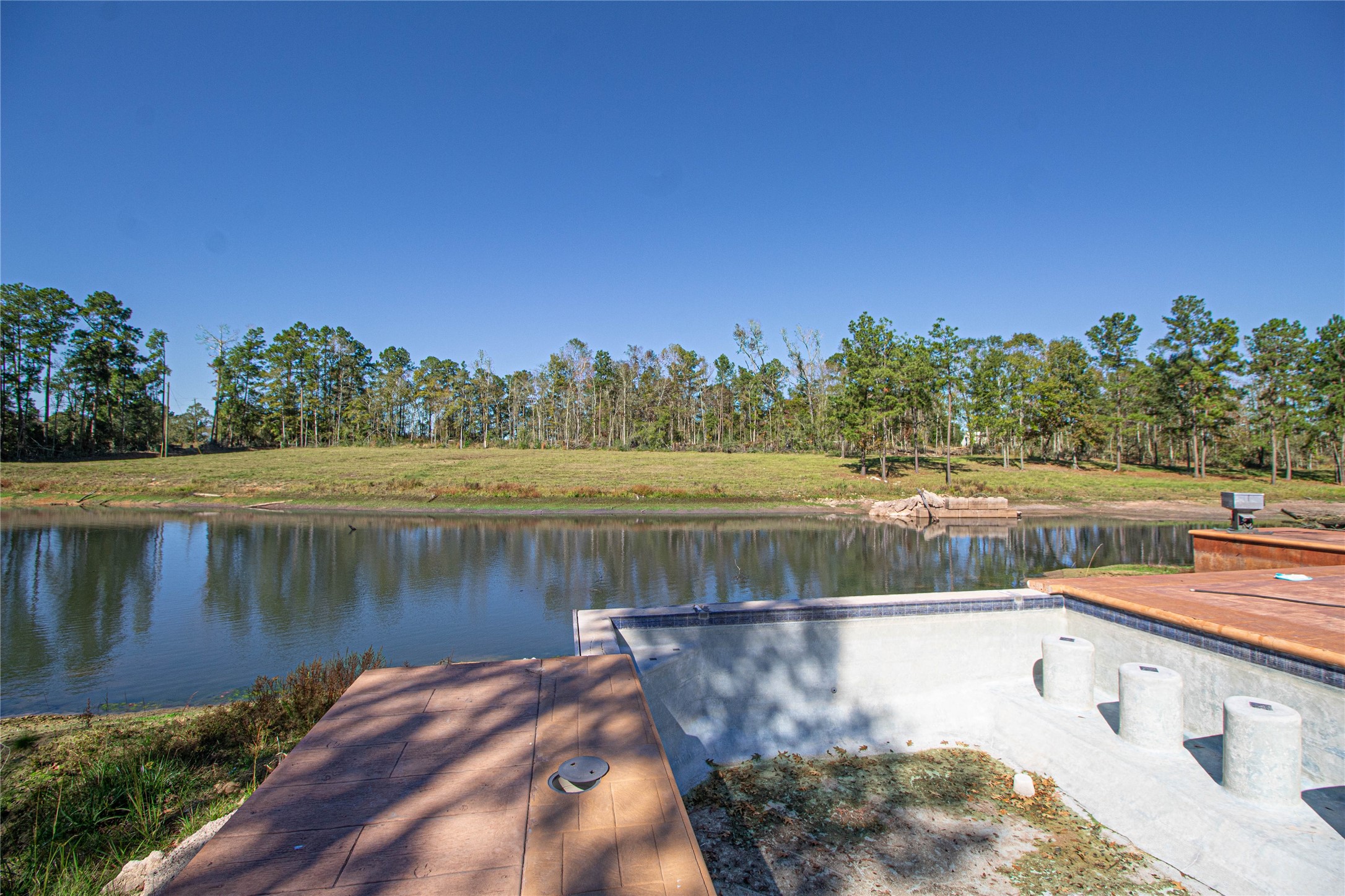 1275 Castlewood Road Livingston, TX 77351 - Photo 14 of 50 a view of a lake with houses in the back