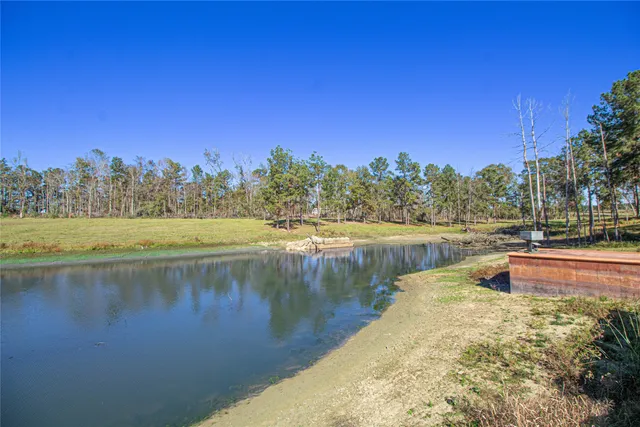 a view of a lake with trees by side of the lake