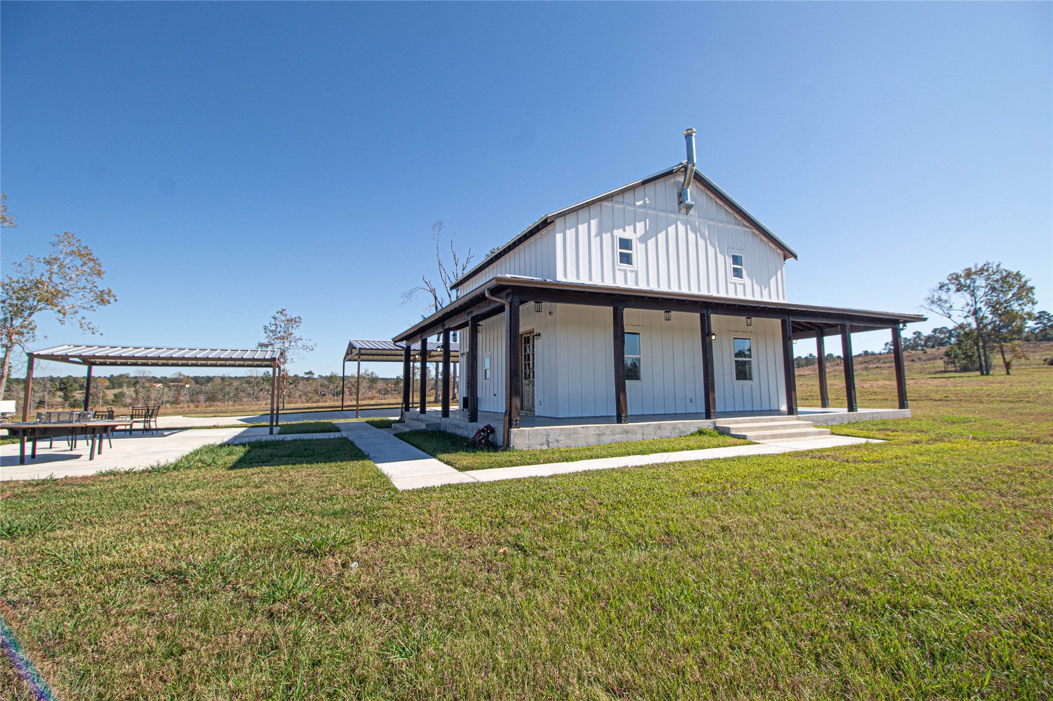 1275 Castlewood Road Livingston, TX 77351 - Photo 26 of 50 a view of a house with a yard and lake view