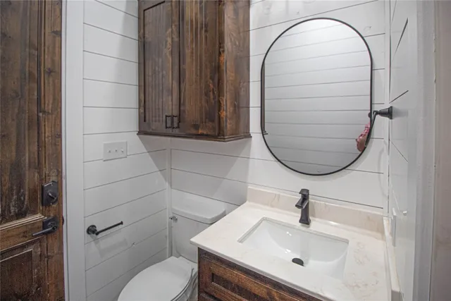 a bathroom with double vanity and a bathtub