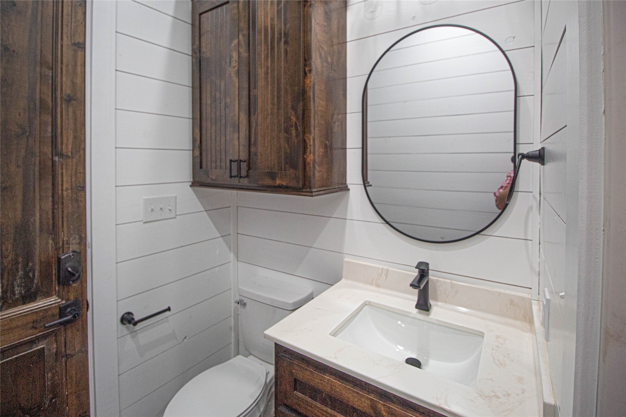 1275 Castlewood Road Livingston, TX 77351 - Photo 29 of 50 a bathroom with a sink a toilet and a mirror